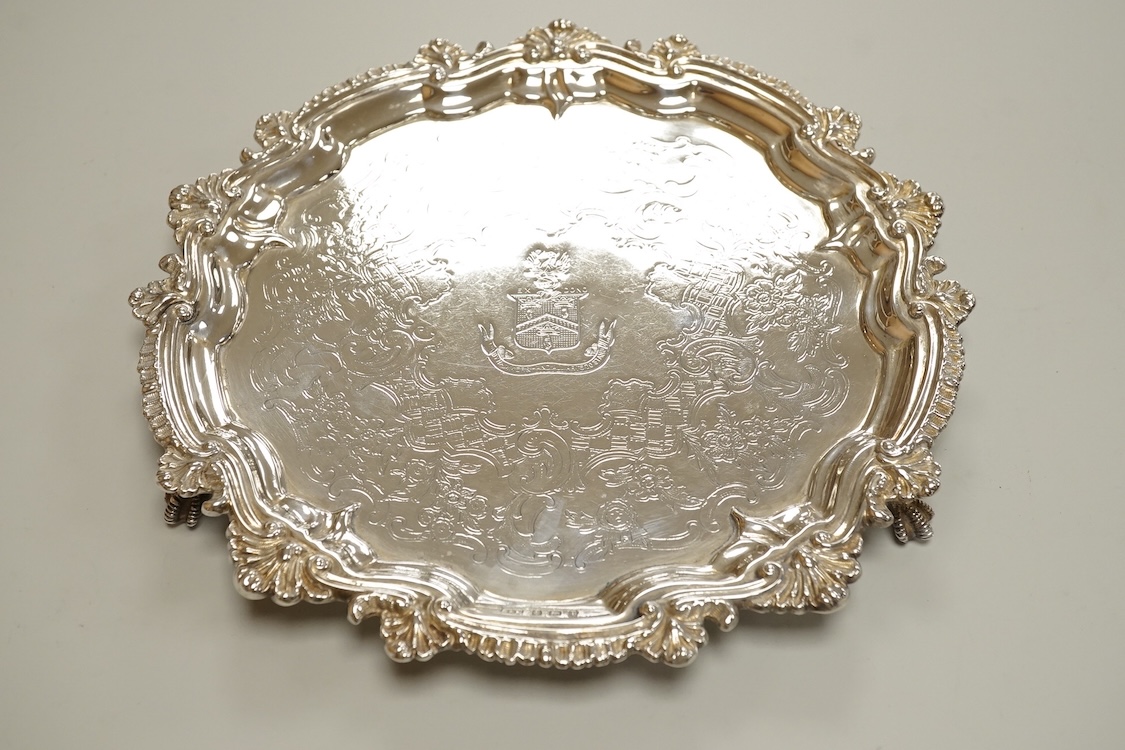 A George V silver waiter, with engraved crest and shell and scroll border, Deykin & Harrison, Birmingham, 1910, 21.5cm, 8.9oz.